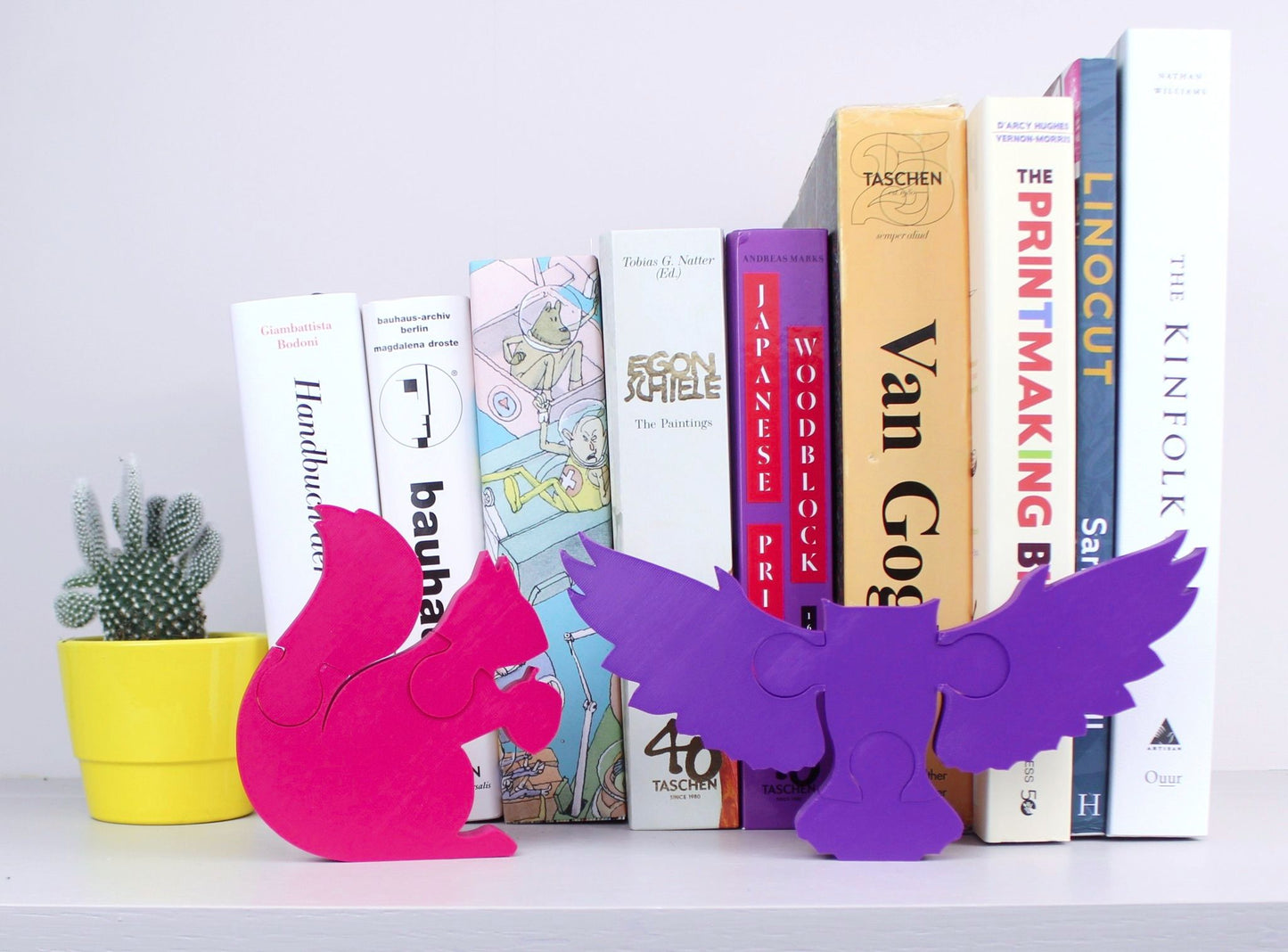 Owl and Squirrel puzzles on a shelf
