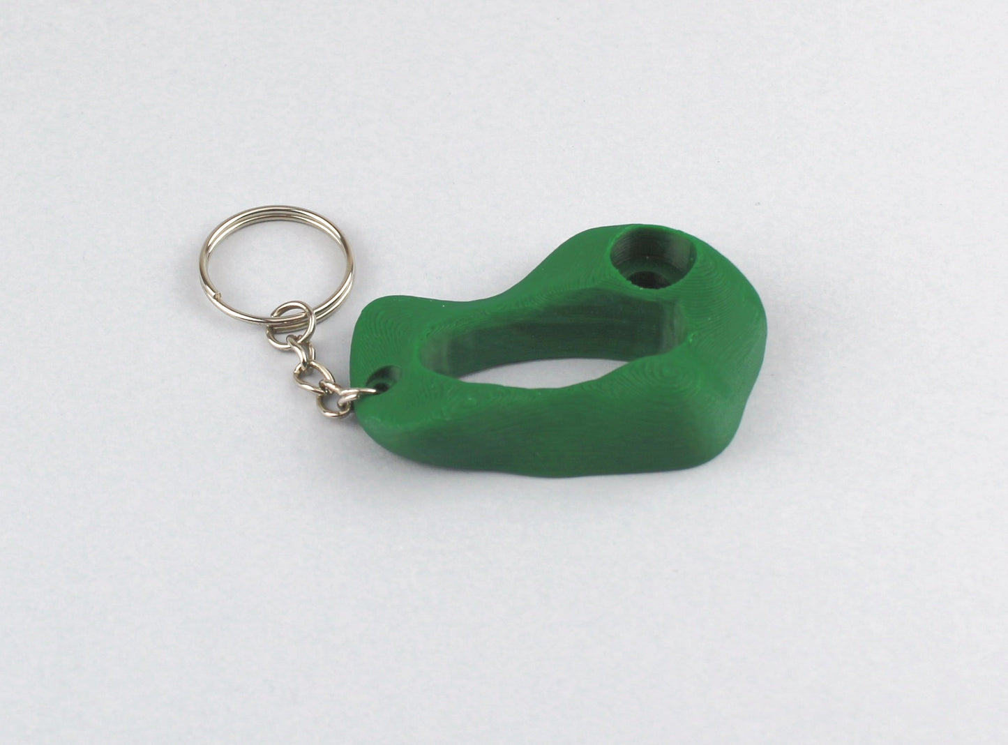 A Green Climbing Hold keychain