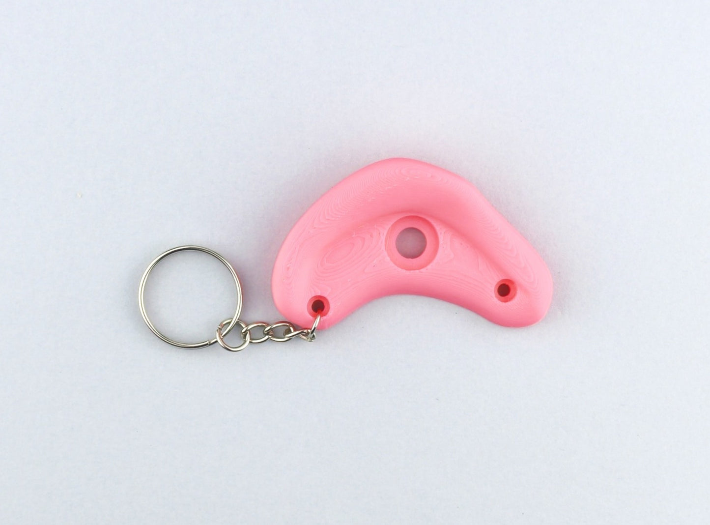 A Pink Climbing Hold keychain