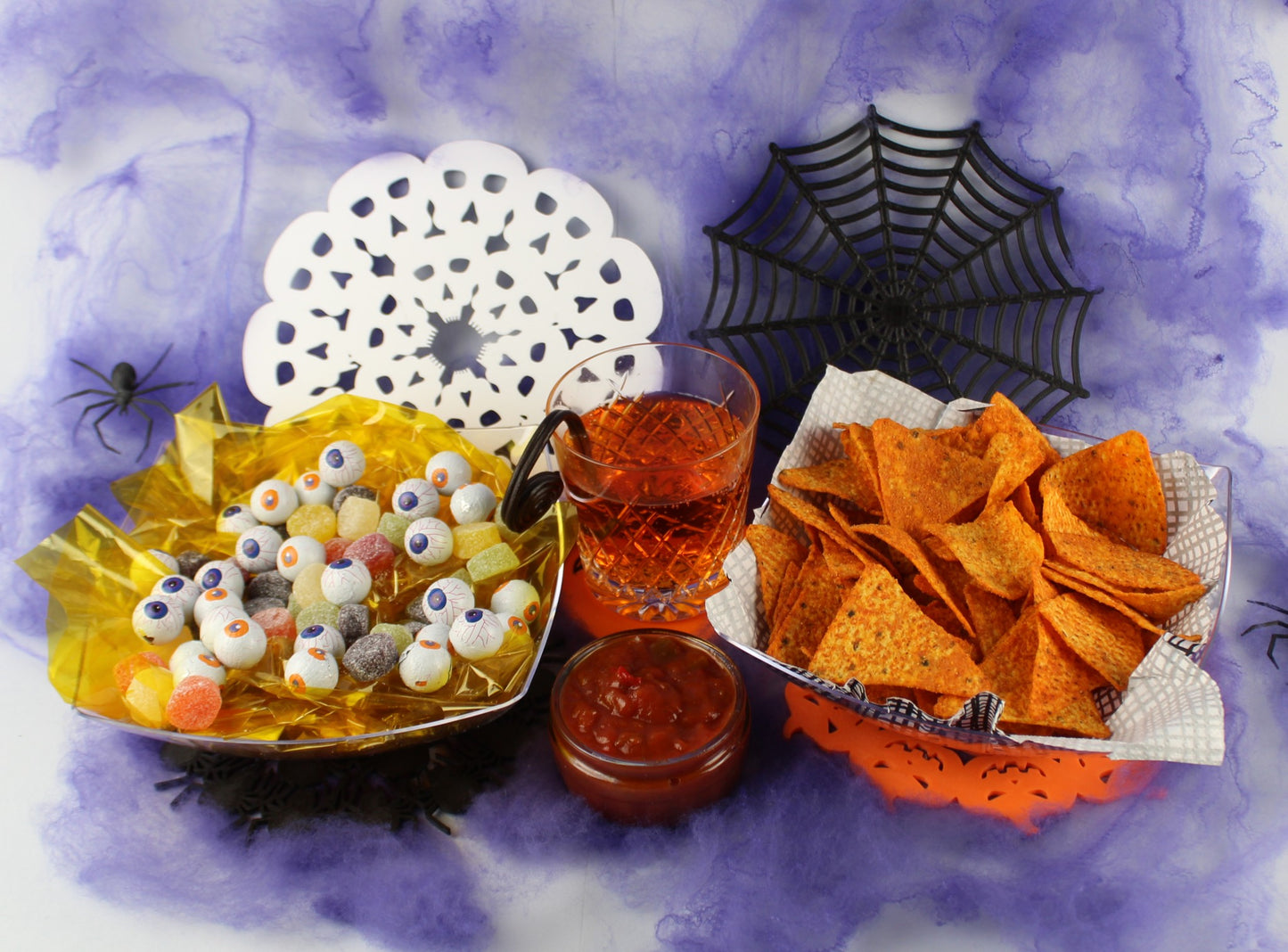 3D Printed Halloween Table Decorations on a Table With a Bowls of Candy and Nachos