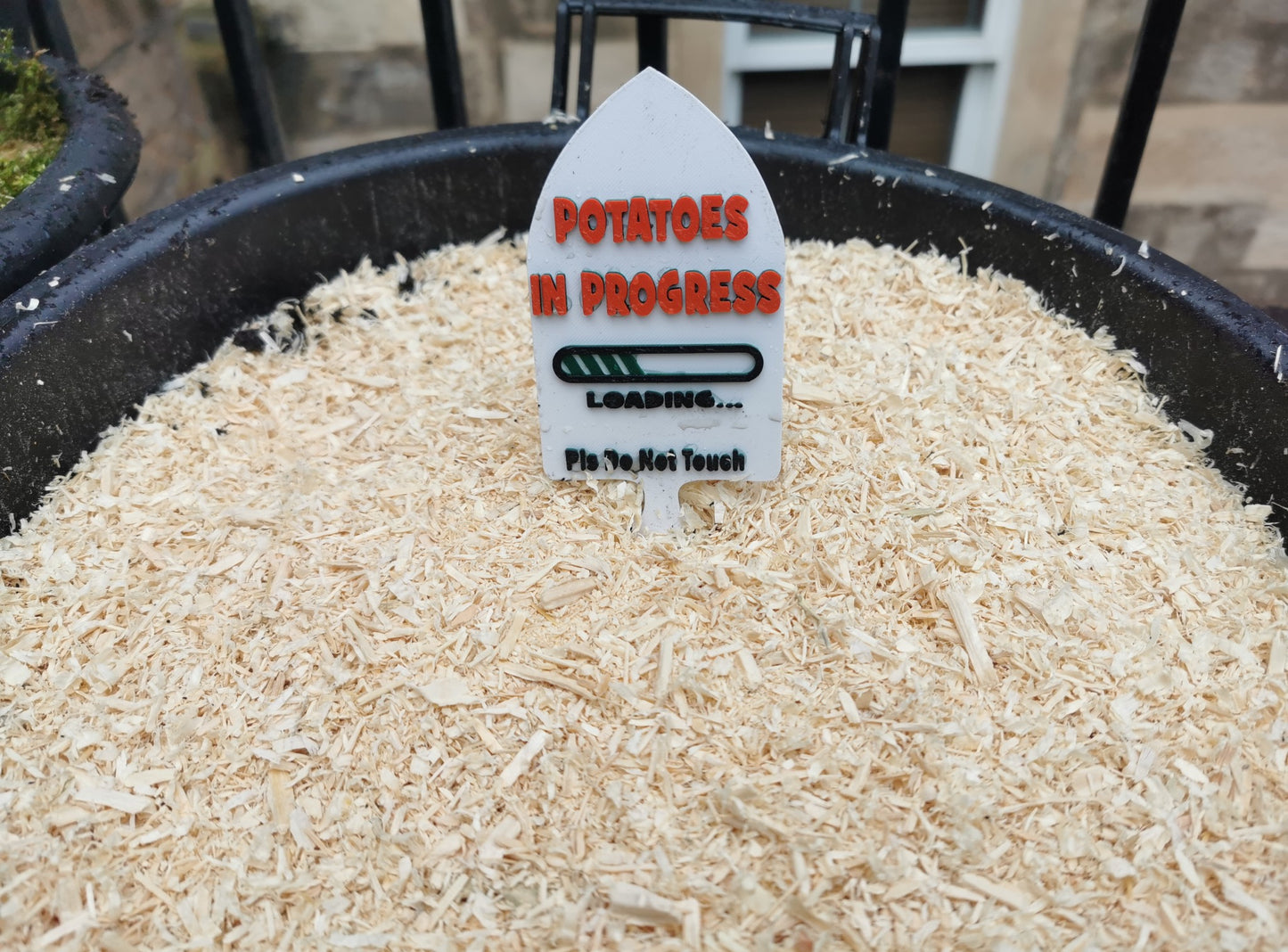 Personalised Trowel Shaped Plant Marker in a bucket of soil