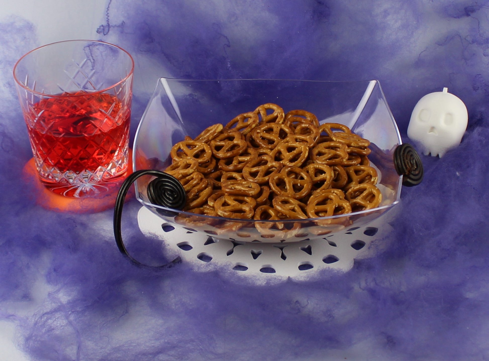 3D Printed Skulls Table Decoration on a Table With a Bowl of Candy