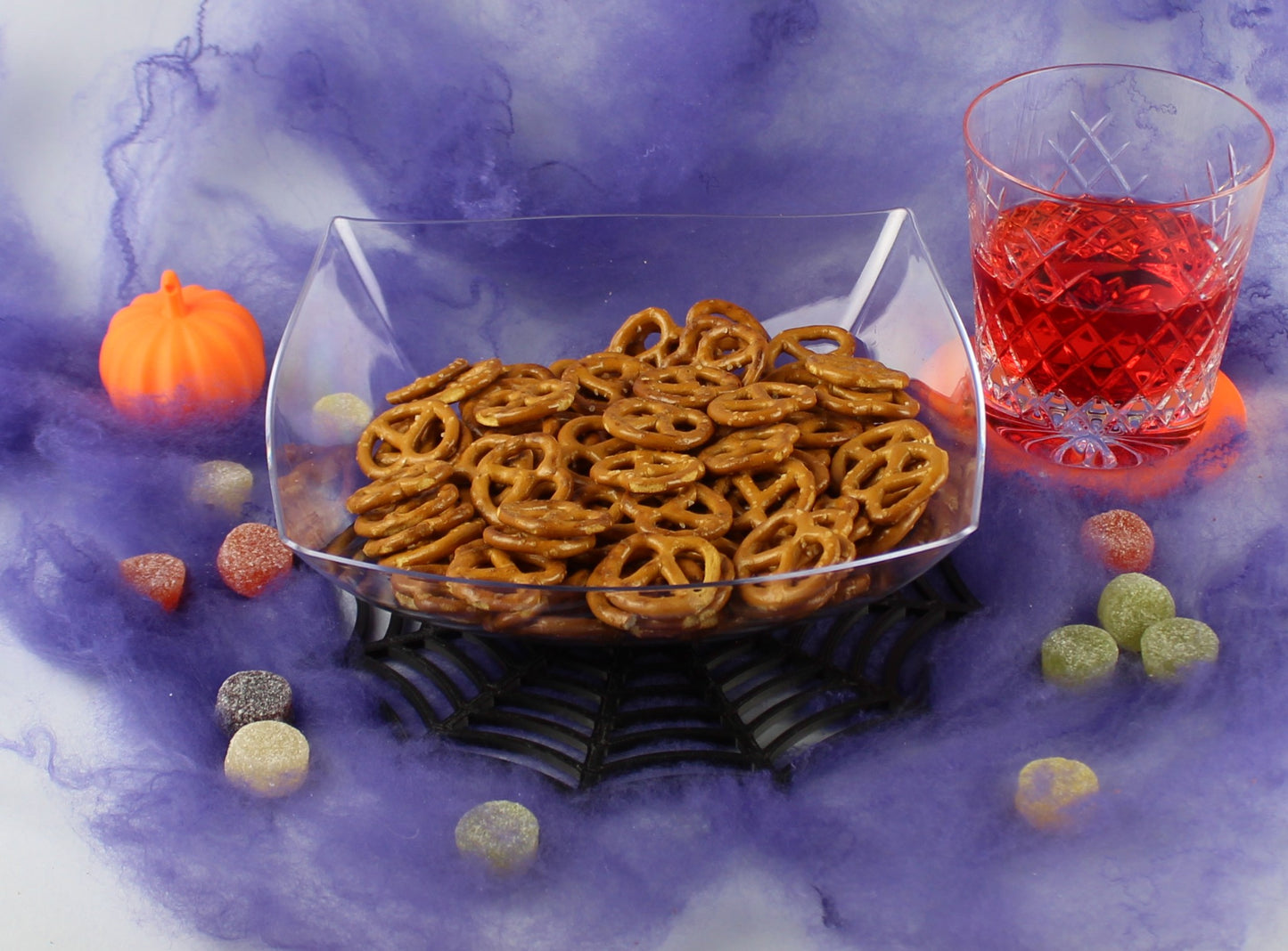 3D Printed Spider Web Table Decoration on a Table With a Bowl of Candy
