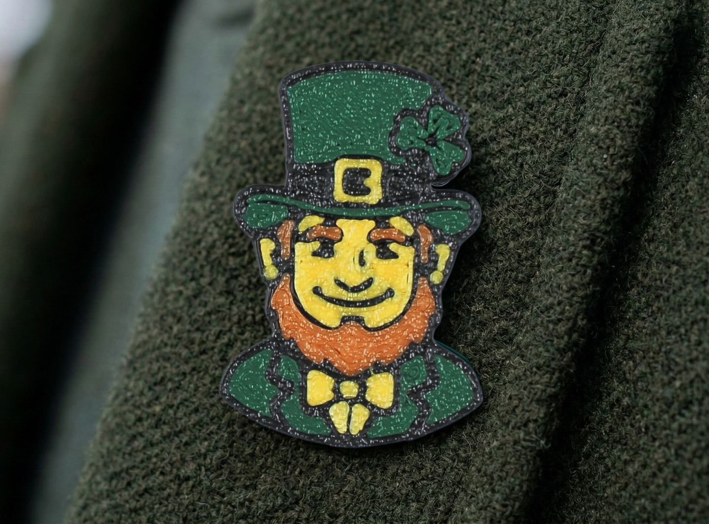 Leprechaun pin on a green fabric background