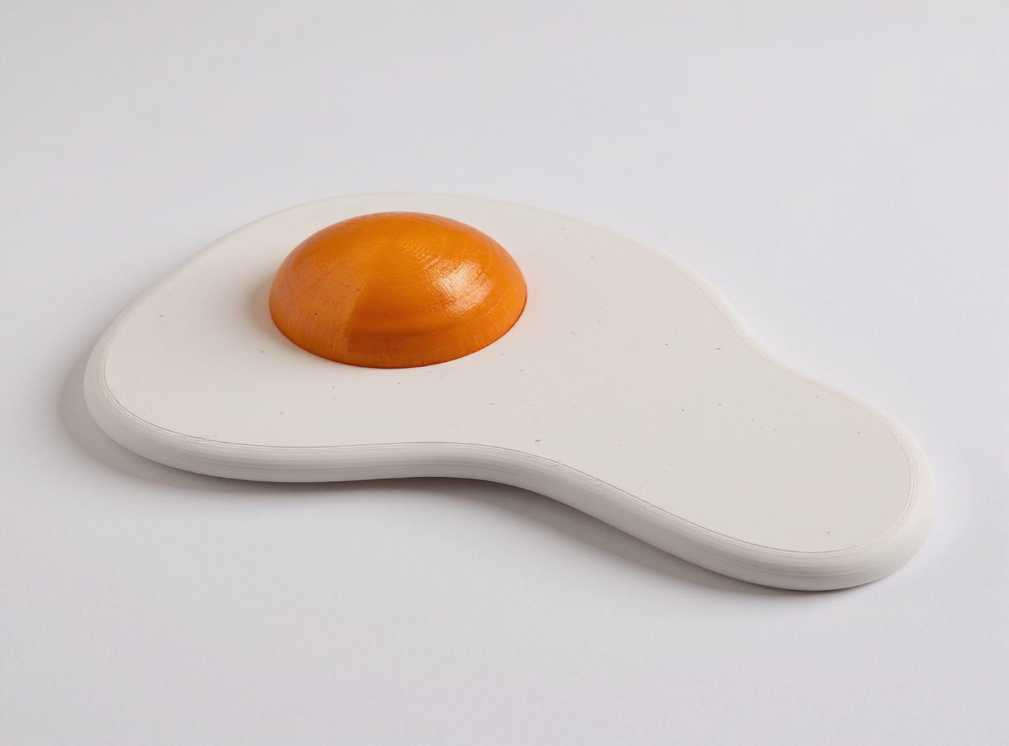 3D Printed Fried Egg Shaped Lamp on a light gray background