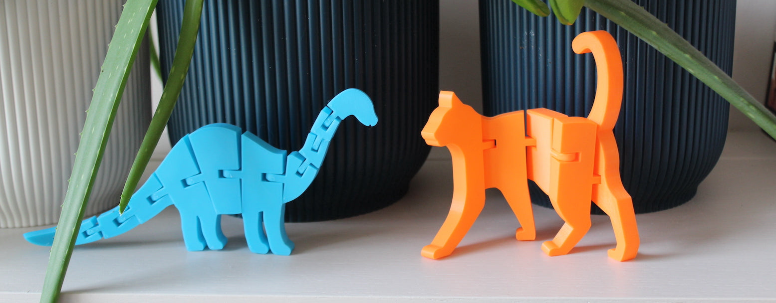 An articulated Dinosaur and a Cat on a shelf