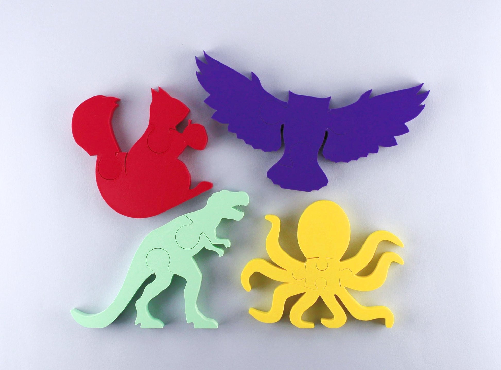 Four animal puzzles: t-rex, octopus, owl, squirrel