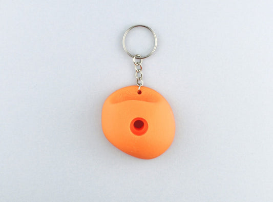An Orange Climbing Hold keychain