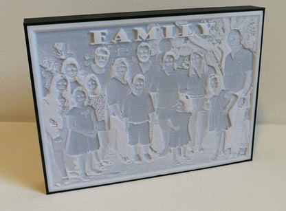 Lithophane lamp turned off, showing a three-dimensional outline of a family with a caption