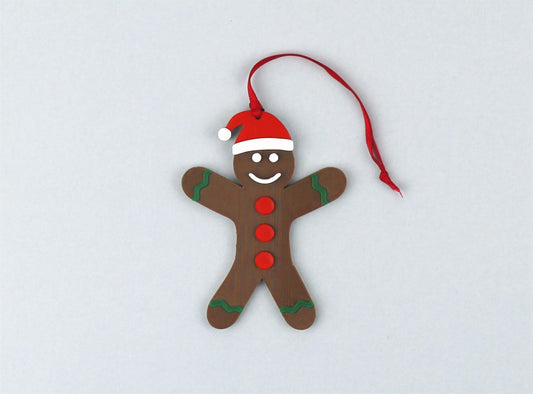 Gingerbread Man Christmas Ornament with a red ribbon