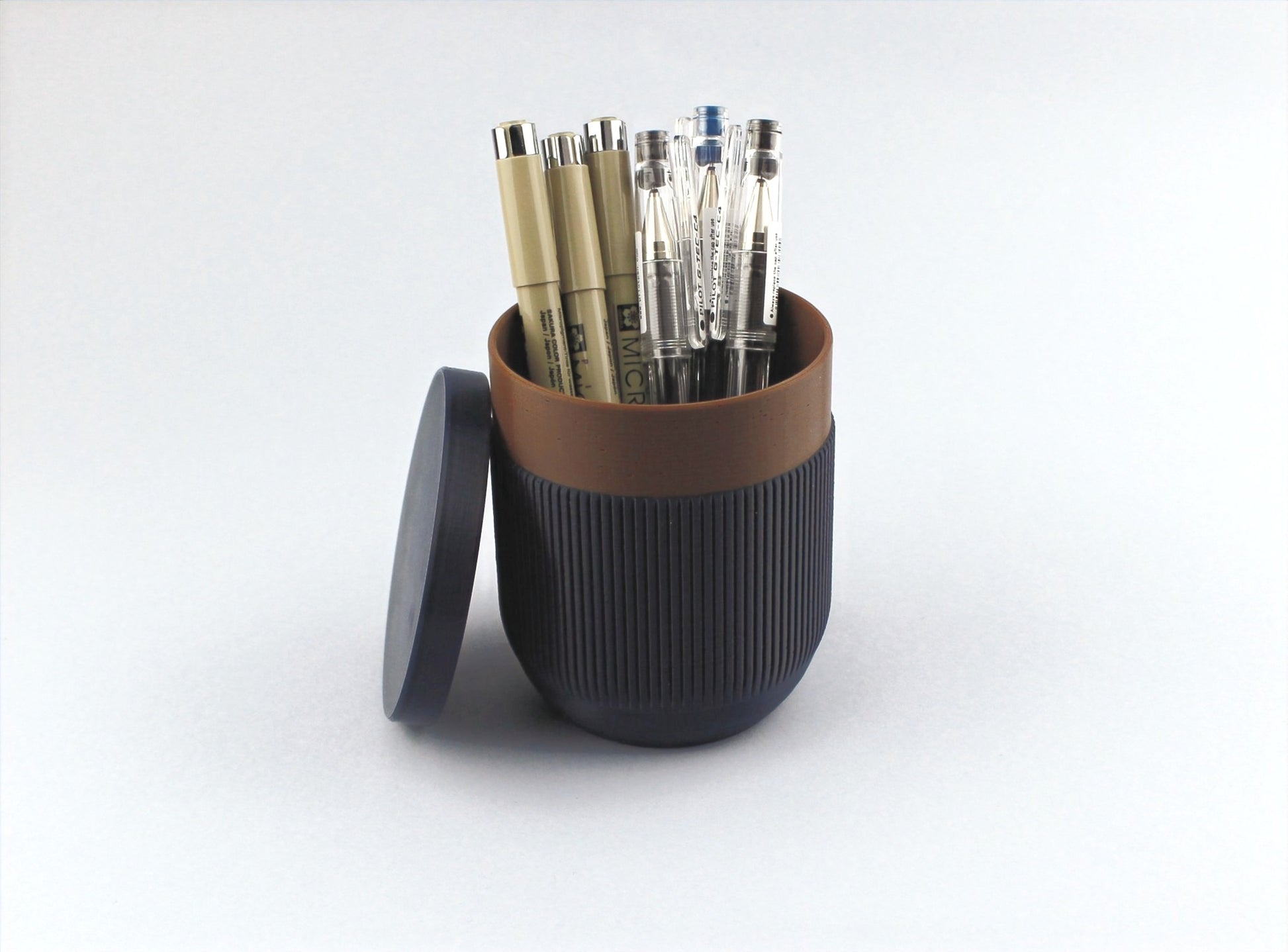 3D Printed Pen Holder full of pens and its lid