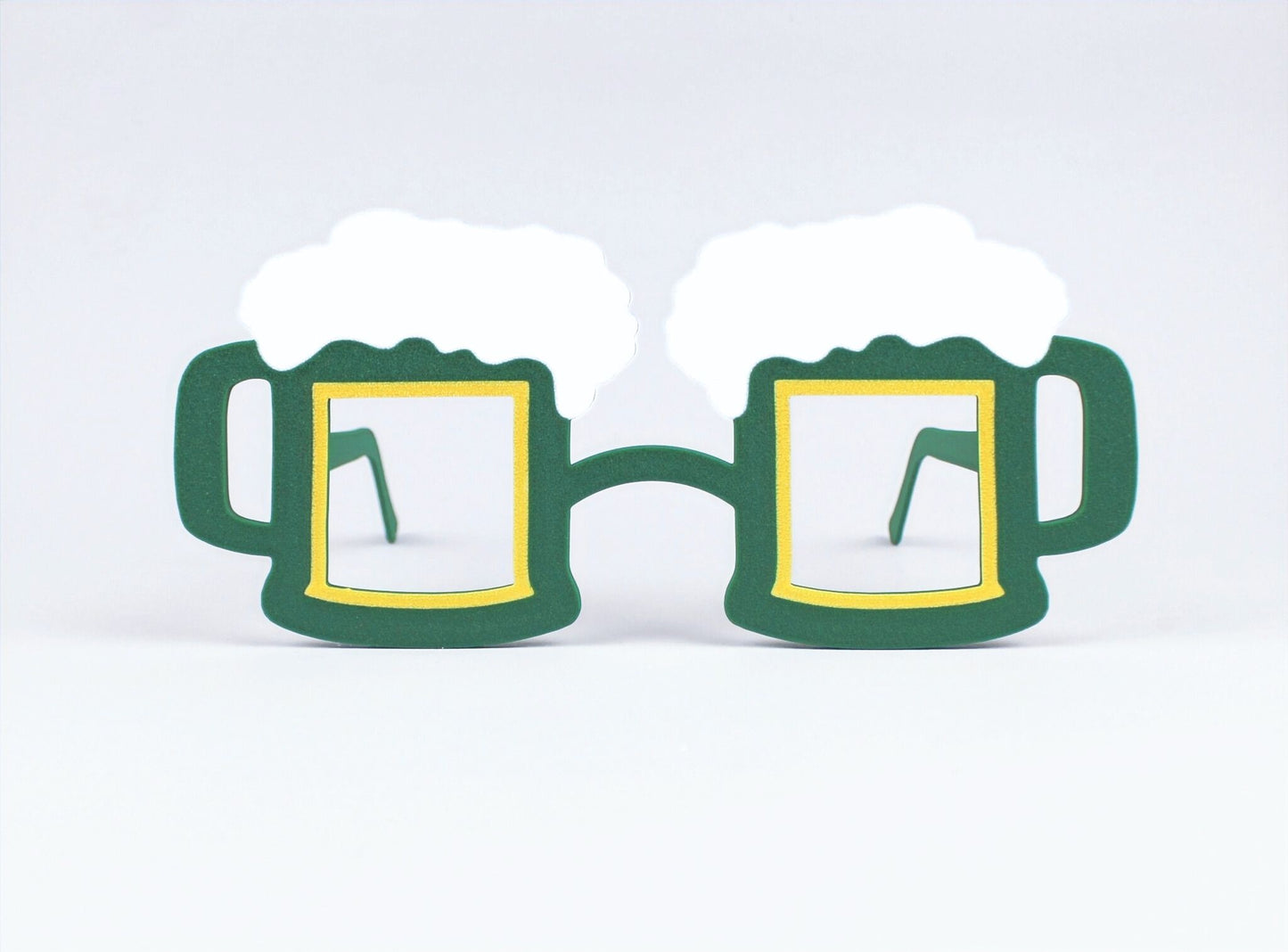 Green 3D-Printed St. Patrick's Day beer mug-shaped novelty glasses on a light gray background