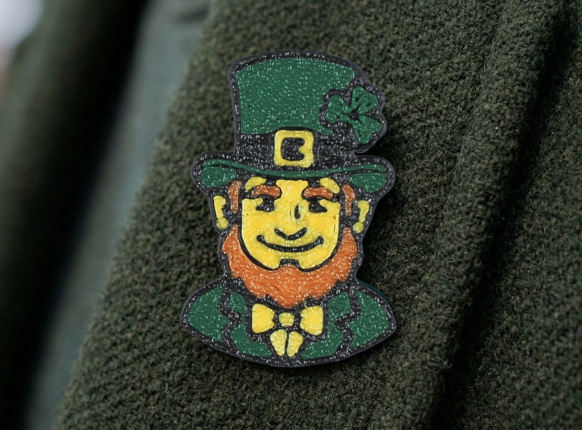 Leprechaun pin on a green fabric background