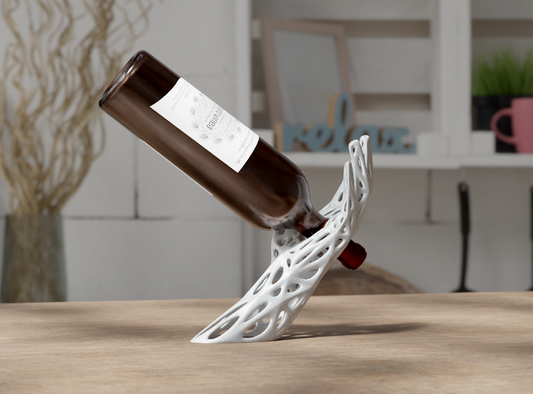 Wine bottle on a decorative white wine holder against  a blurred indoor background
