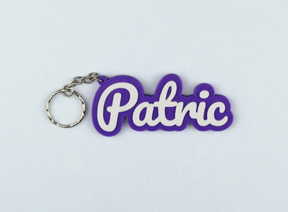 3D Printed Purple keychain with 'Patric' text on a light gray background