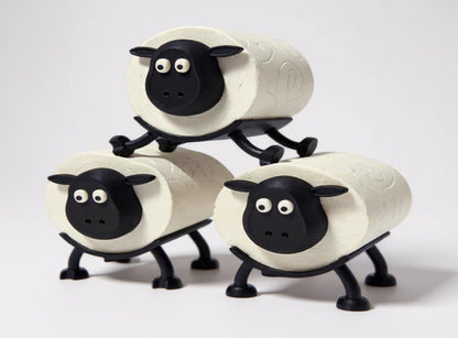 Three sheep-shaped toilet paper roll holder on a stand against a white background