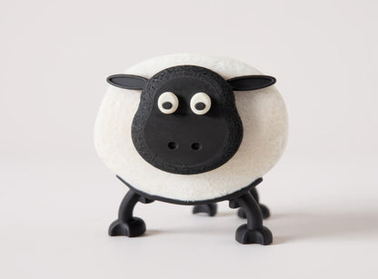 Black and white Sheep Toilet Roll Holder on a light gray background