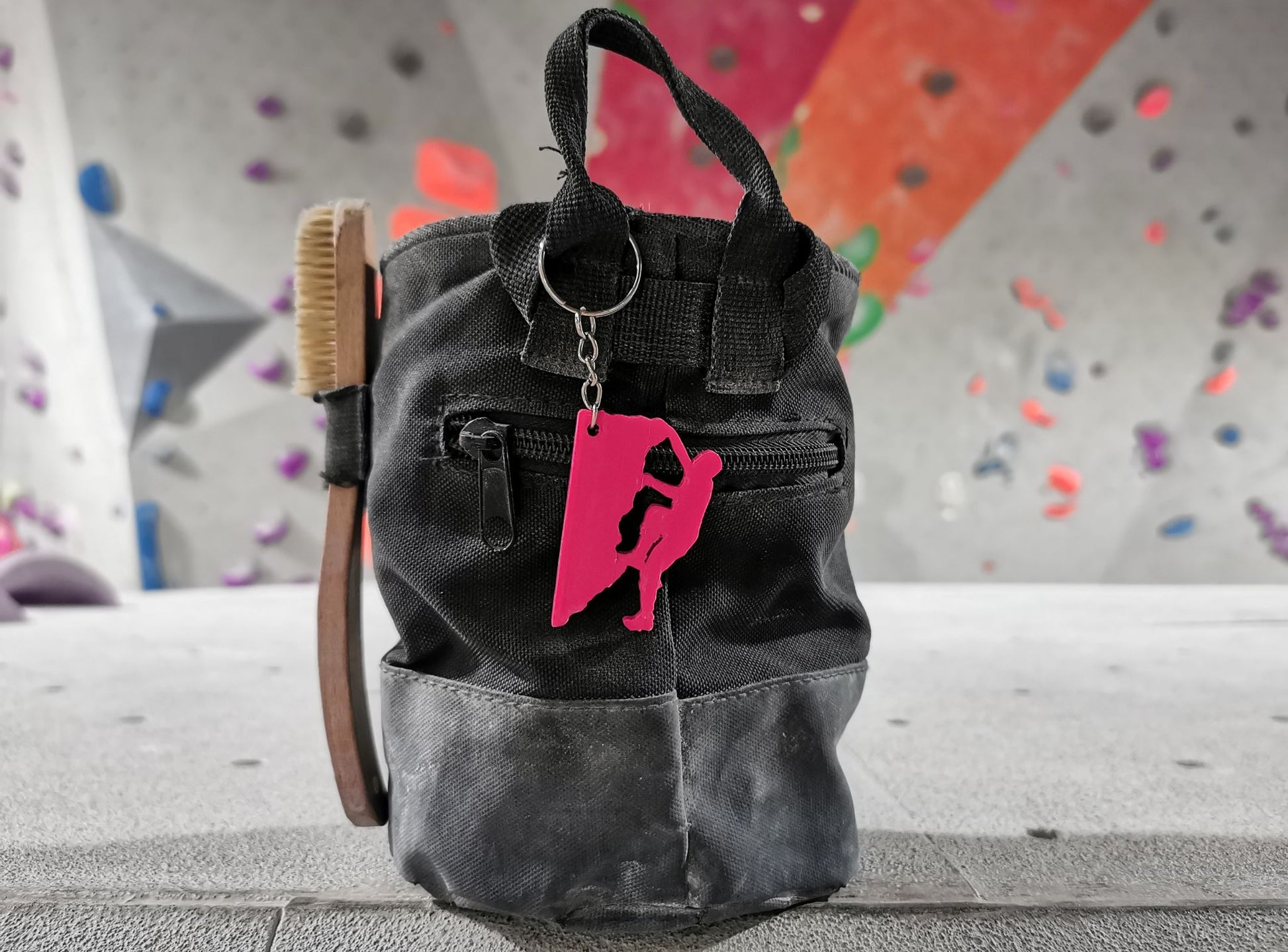 Chalk Bag With A Magenta Rock Climbing Figure Keychain