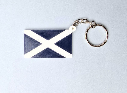 Keychain with Scotland flag design on a light gray background