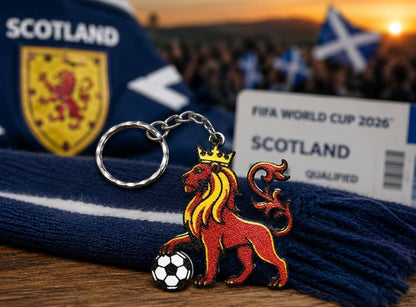 Keychain with lion emblem and soccer ball, Scotland scarf, and FIFA World Cup 2026 Scotland qualified banner.