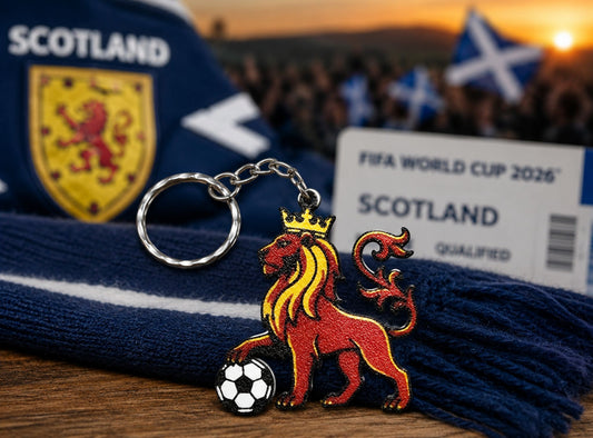Keychain with lion emblem and soccer ball, Scotland scarf, and FIFA World Cup 2026 Scotland qualified banner.